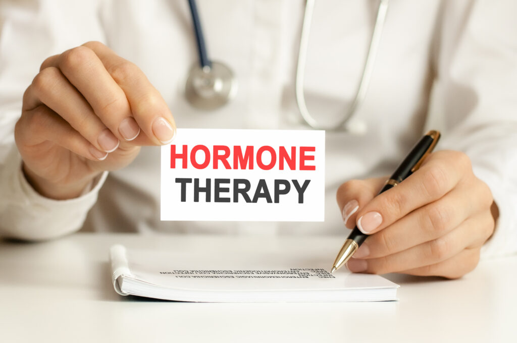 doctor holding card hand with words hormone therapy medical concept healthcare conceptual hospital clinic medical busines