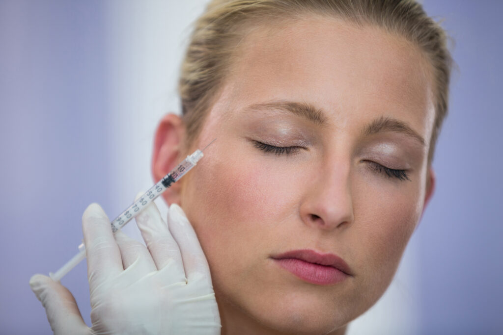female patient receiving botox injection face