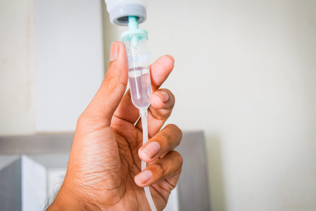 hand holding solution iv drip