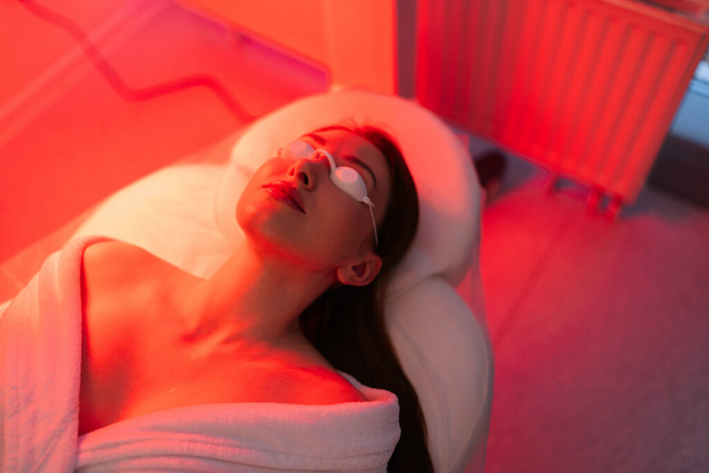 top view face female client lying noninvasive type phototherapy closeup woman